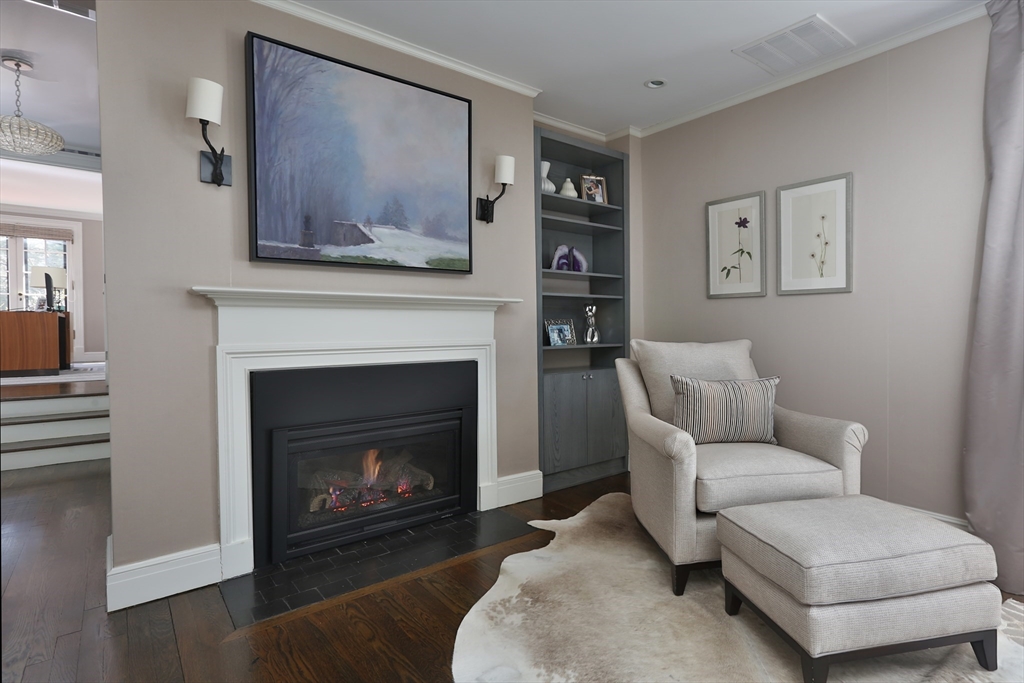 39 Worthington Road Brookline, MA 02446 - Photo 17 of 40 a living room with furniture and a fireplace