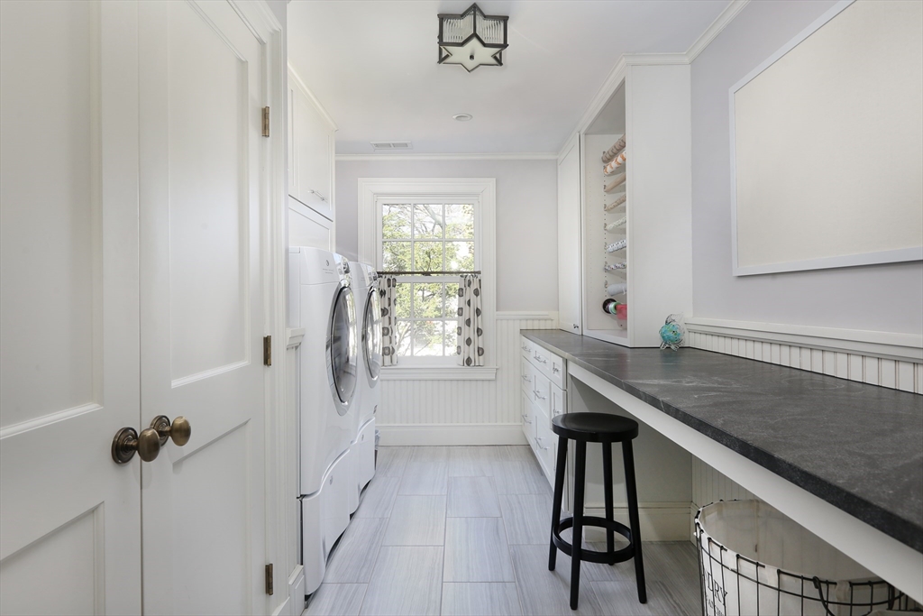 39 Worthington Road Brookline, MA 02446 - Photo 28 of 40 a bathroom with a granite countertop sink a toilet and window