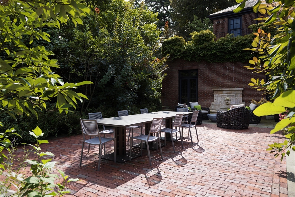 39 Worthington Road Brookline, MA 02446 - Photo 33 of 40 a view of a dinning table and chairs in the patio