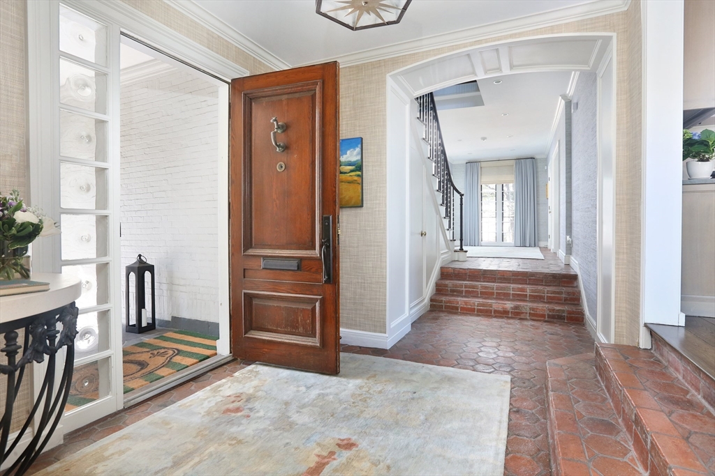 39 Worthington Road Brookline, MA 02446 - Photo 6 of 40 a view of a hallway with wooden floor and windows