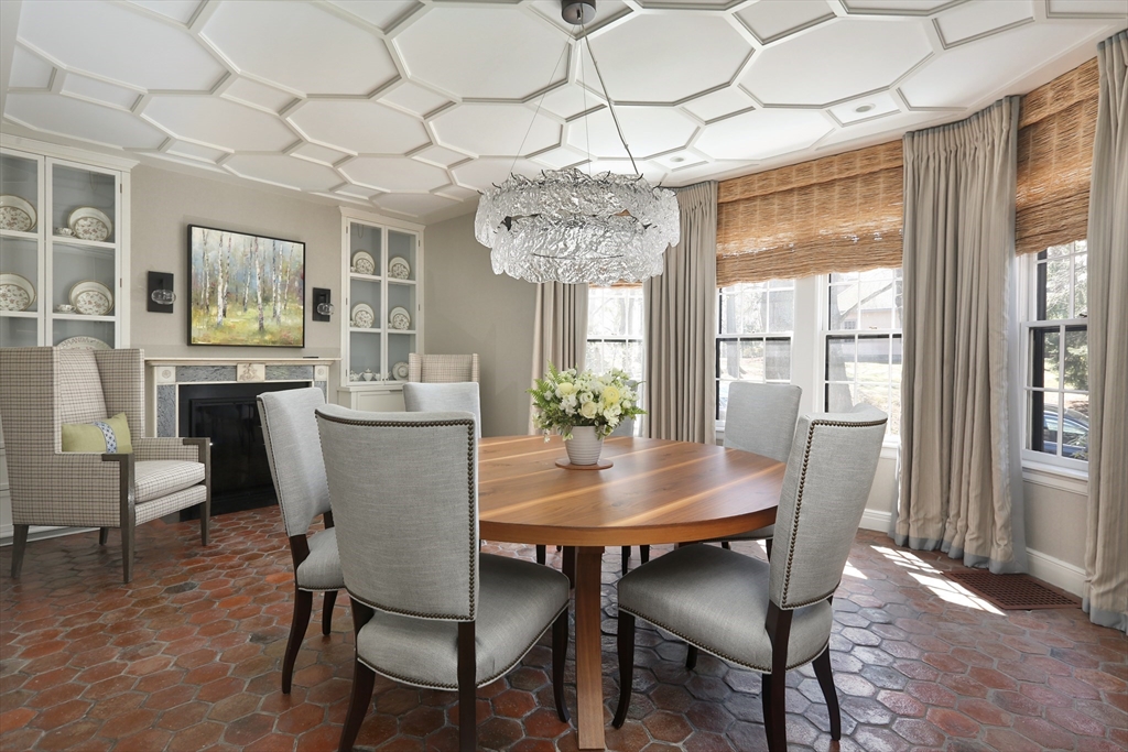 39 Worthington Road Brookline, MA 02446 - Photo 7 of 40 a dining room with furniture a chandelier and wooden floor