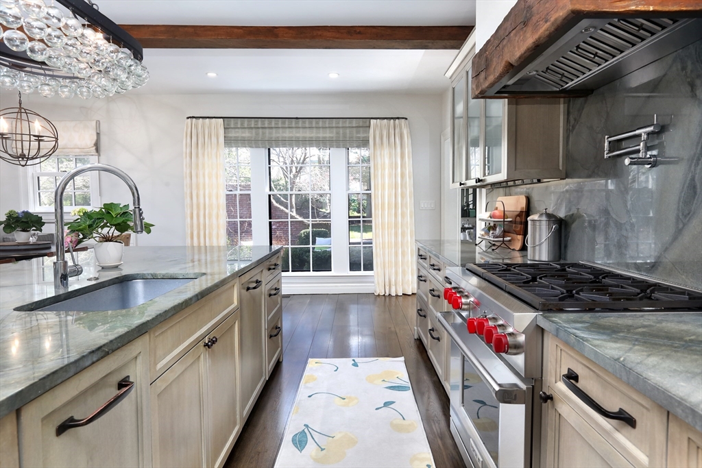 39 Worthington Road Brookline, MA 02446 - Photo 10 of 40 a kitchen with stainless steel appliances granite countertop a sink stove and cabinets