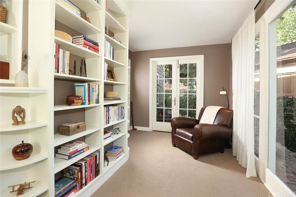 206 Sierra View Road Pasadena, CA 91105 - Photo 25 of 46 a living room with furniture and a book shelf