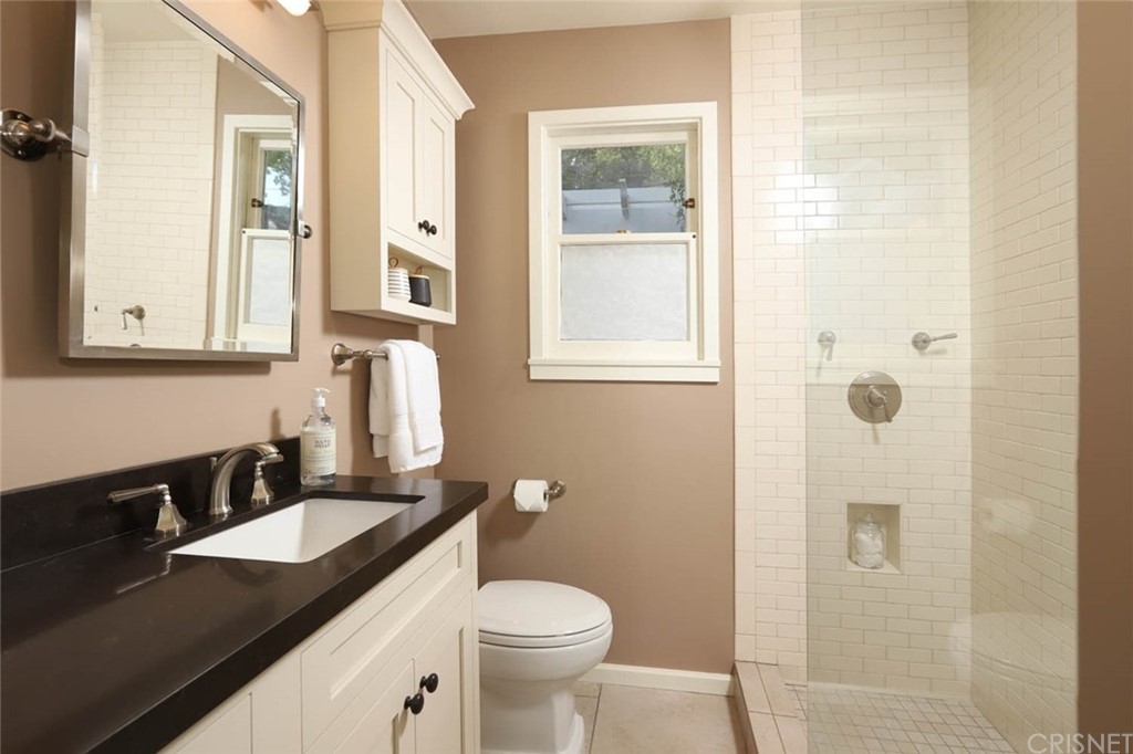 206 Sierra View Road Pasadena, CA 91105 - Photo 29 of 46 a bathroom with a granite countertop sink toilet and shower