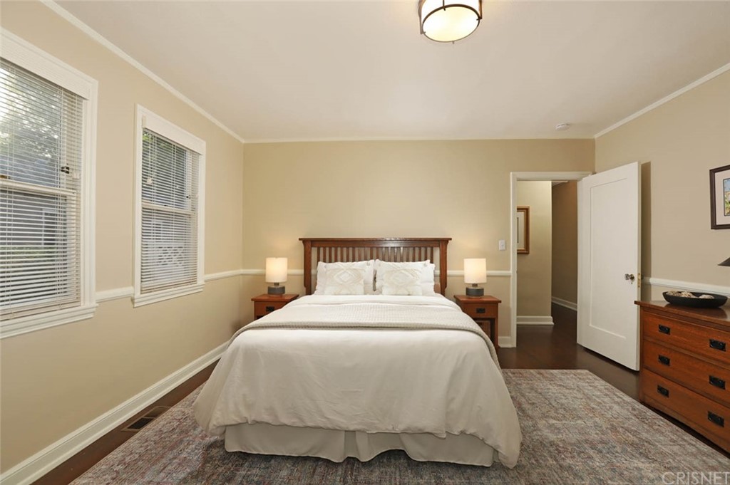 206 Sierra View Road Pasadena, CA 91105 - Photo 32 of 46 a bedroom with a bed and dresser with mirror