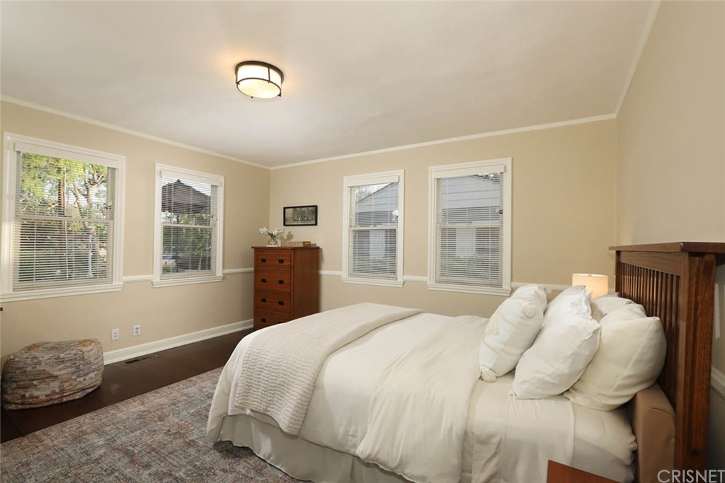 206 Sierra View Road Pasadena, CA 91105 - Photo 33 of 46 a bedroom with a bed and wooden floor