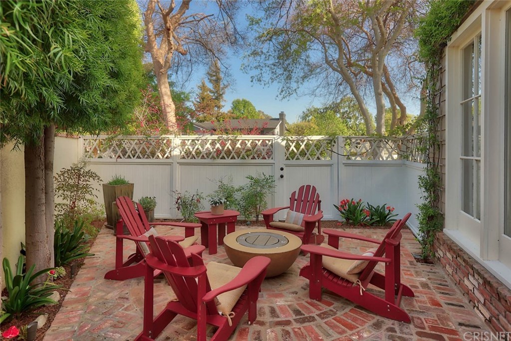 206 Sierra View Road Pasadena, CA 91105 - Photo 40 of 46 a view of a chairs and table in patio with a lake view