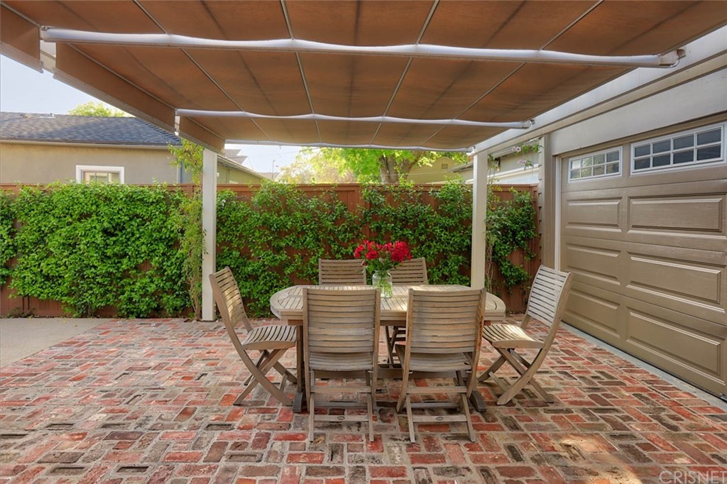 206 Sierra View Road Pasadena, CA 91105 - Photo 43 of 46 a patio with yard glass top table and chairs