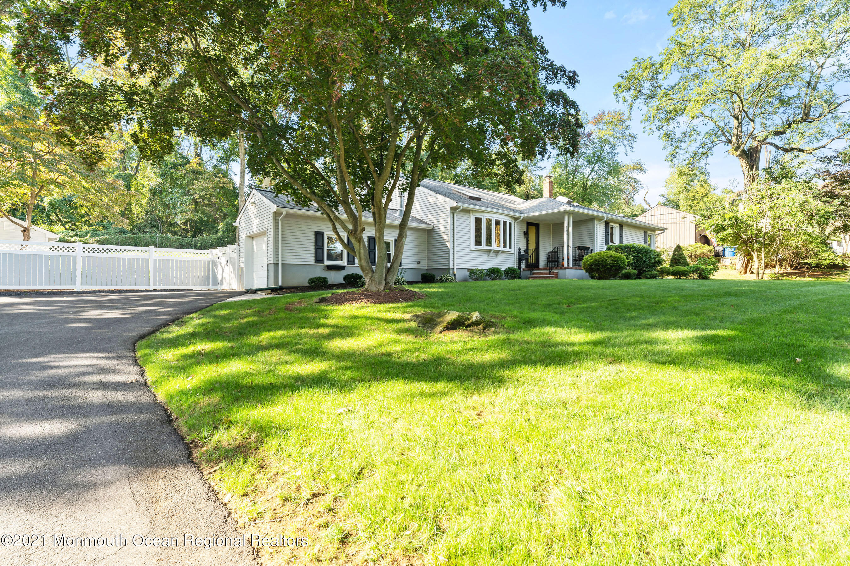 105 Bruce Road Red Bank, NJ 07701 - Photo 1 of 26 a view of a house with a big yard potted plants and large tree