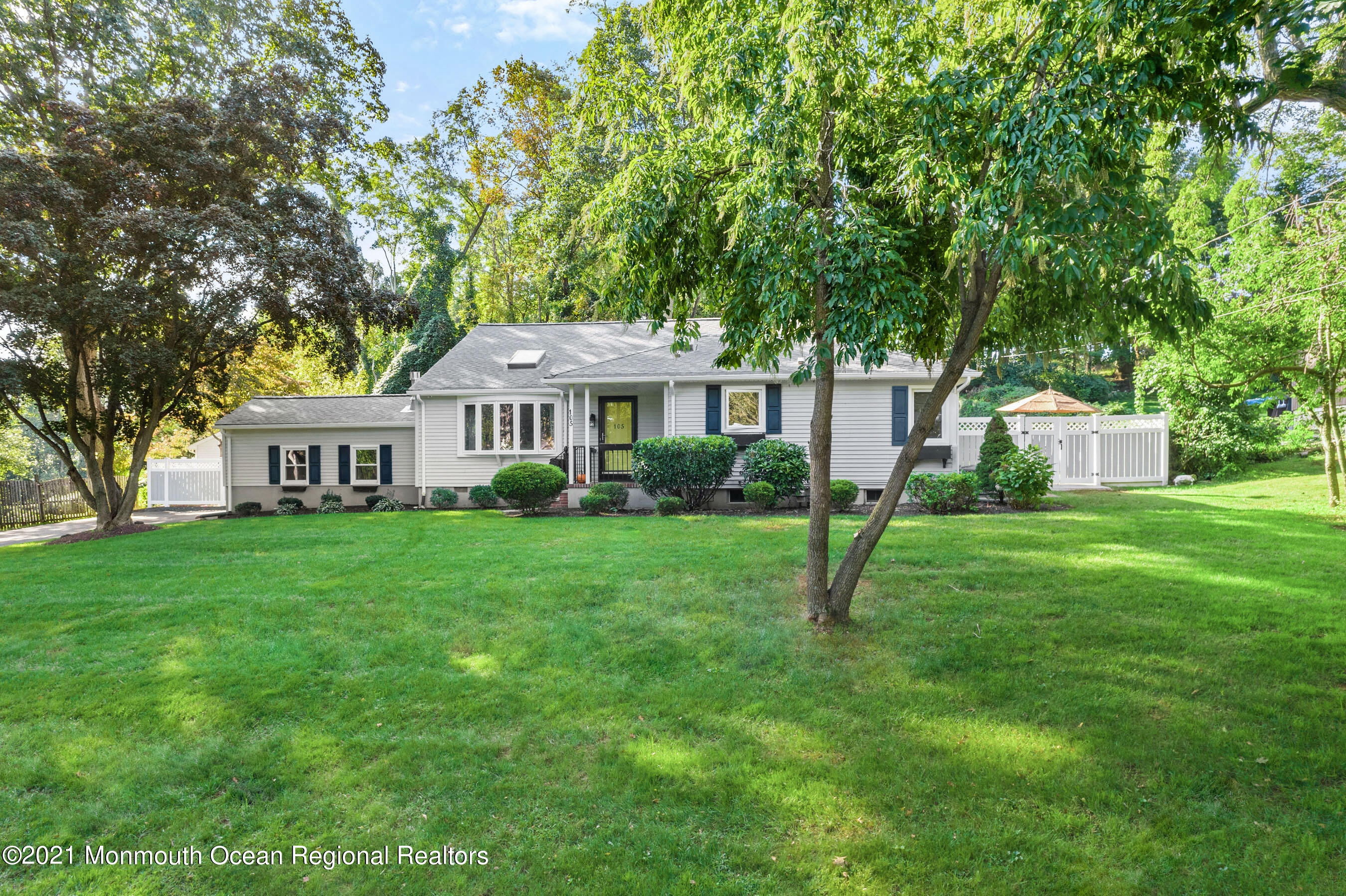 105 Bruce Road Red Bank, NJ 07701 - Photo 2 of 26 a front view of a house with garden