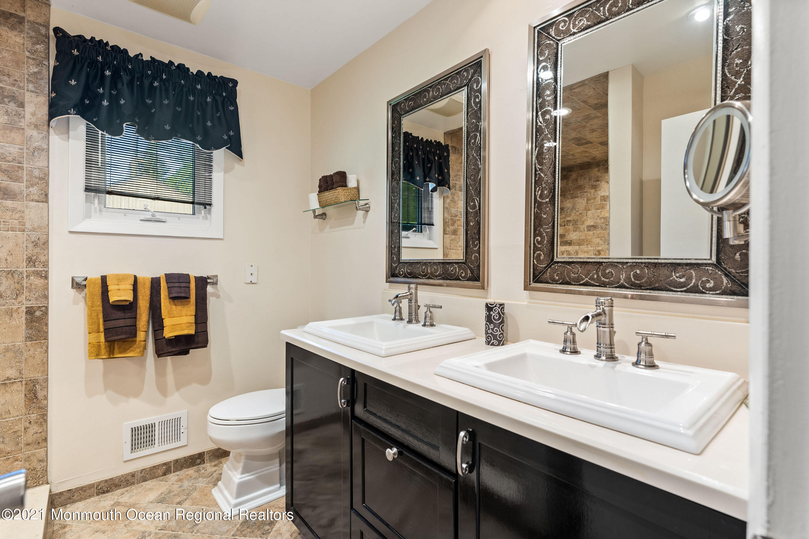 105 Bruce Road Red Bank, NJ 07701 - Photo 14 of 26 a bathroom with a sink a toilet and shower
