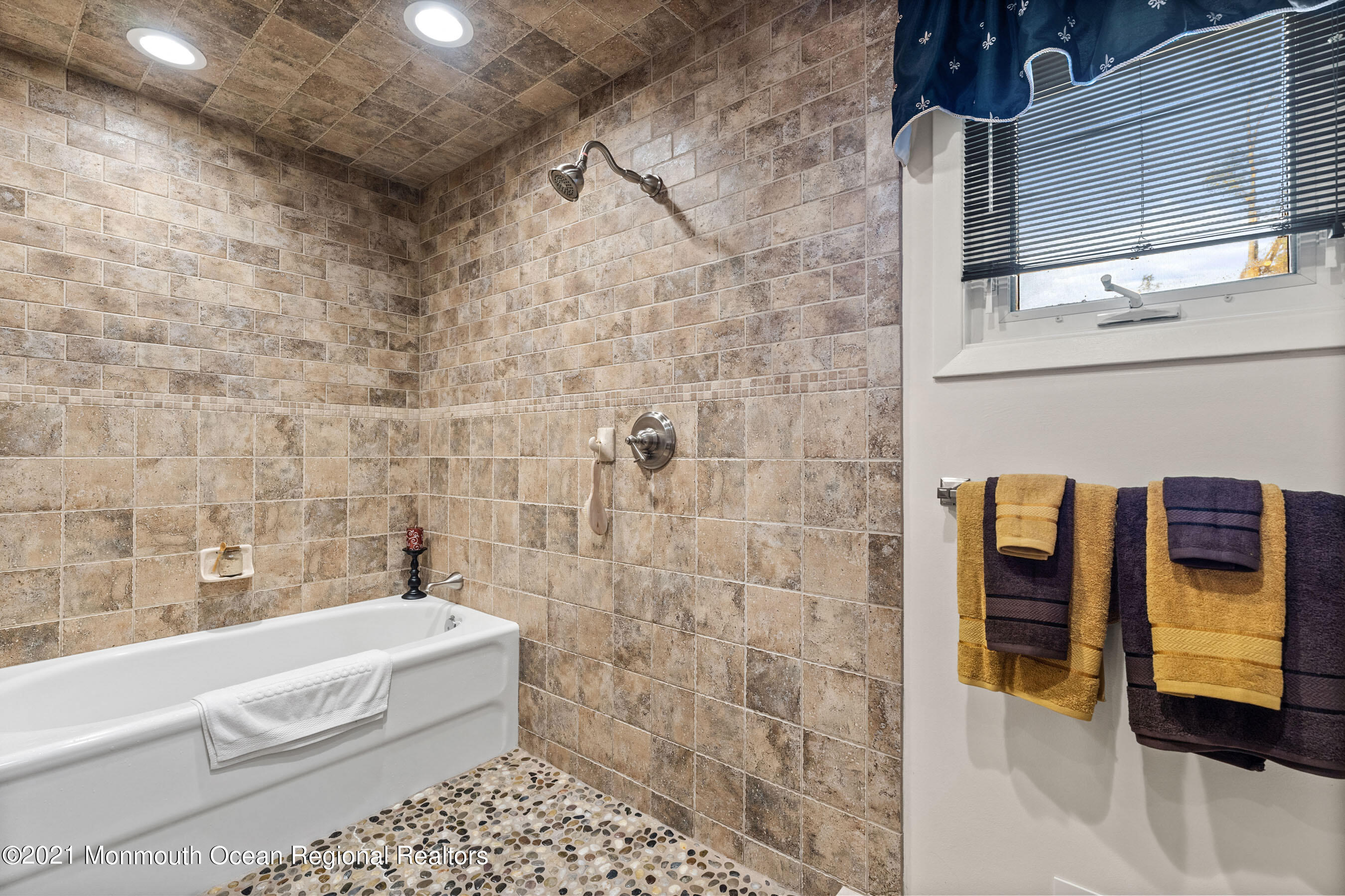 105 Bruce Road Red Bank, NJ 07701 - Photo 15 of 26 a bathroom with a bathtub and a shower