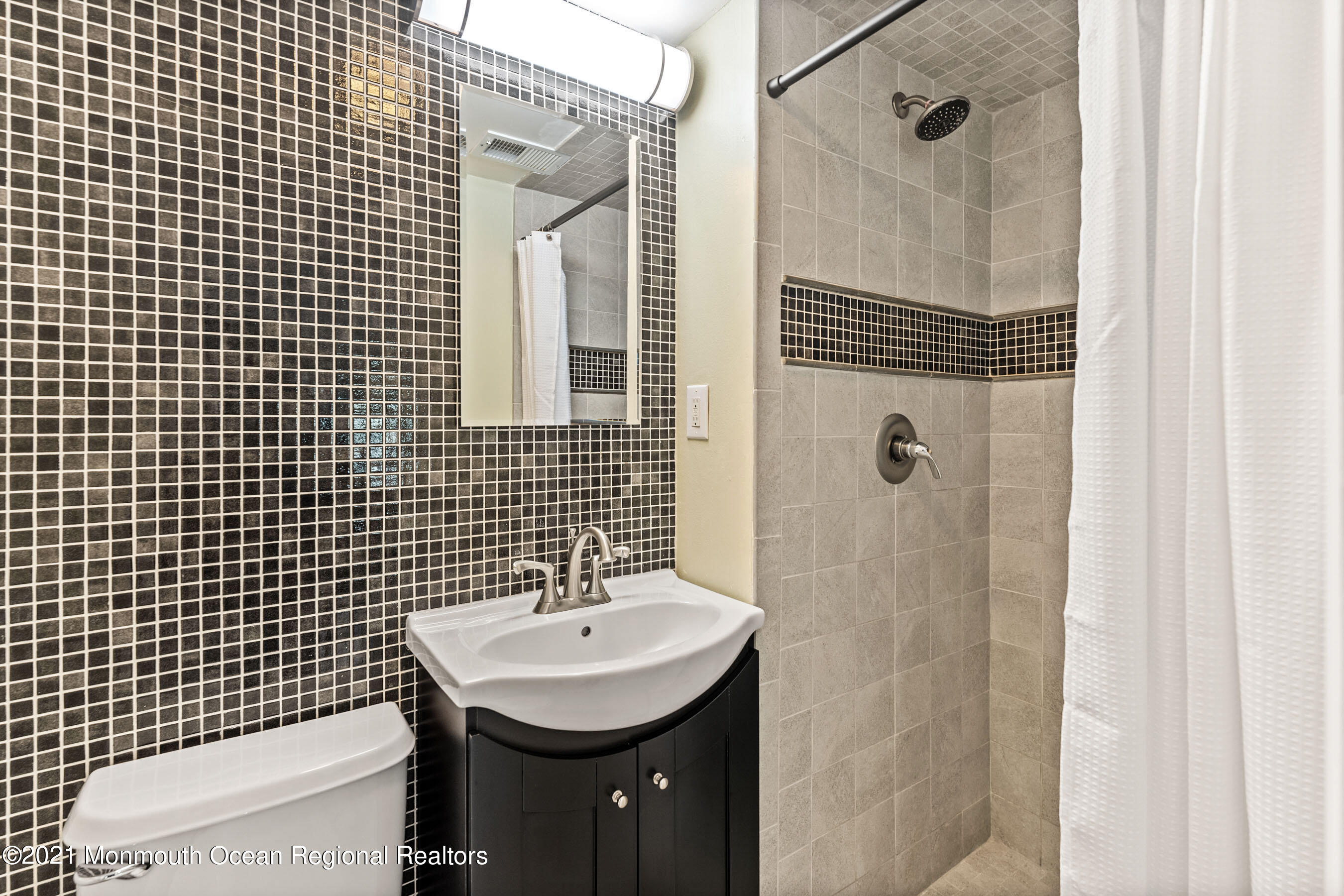 105 Bruce Road Red Bank, NJ 07701 - Photo 19 of 26 a bathroom with a sink toilet and shower