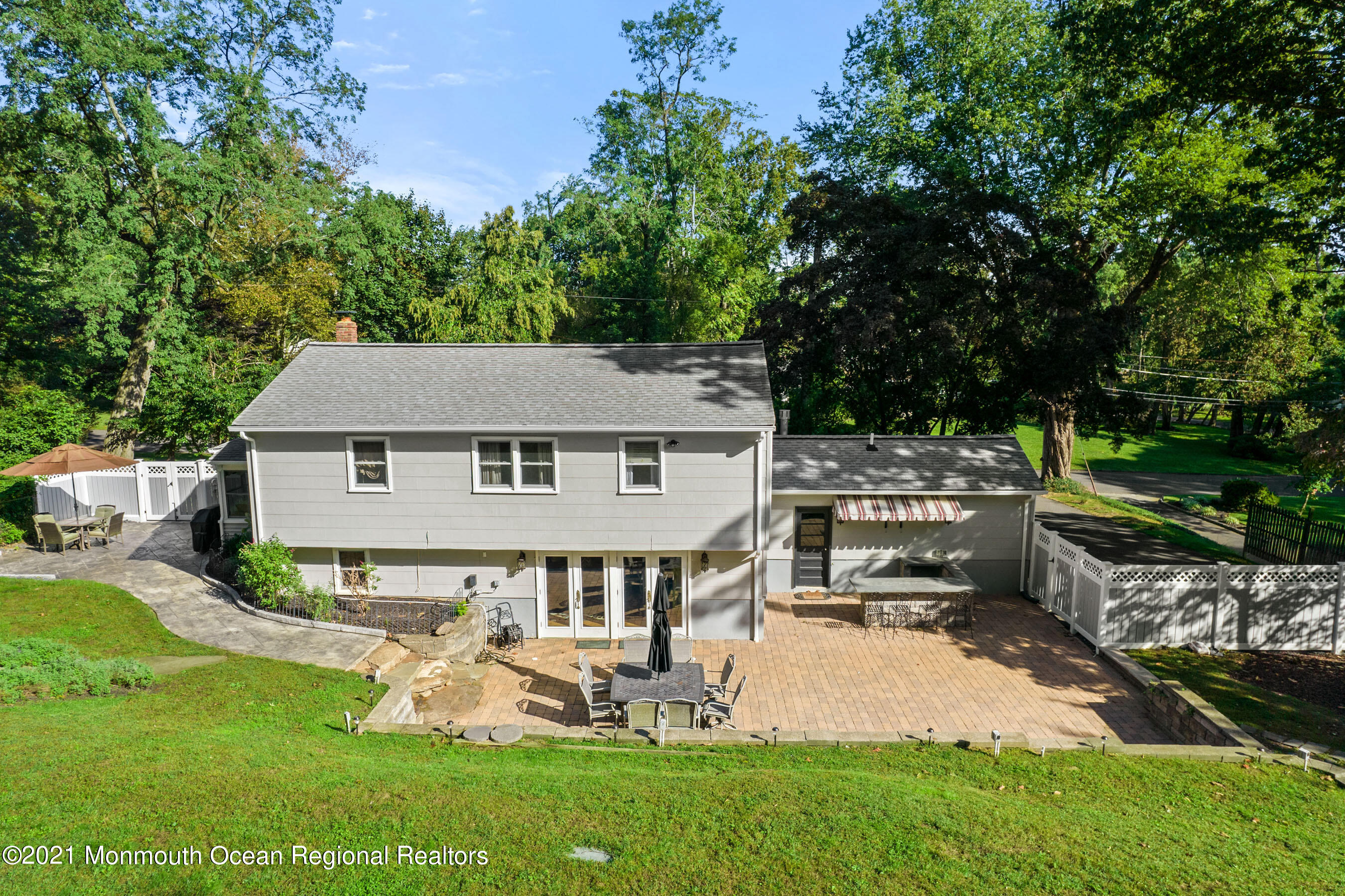 105 Bruce Road Red Bank, NJ 07701 - Photo 22 of 26 a view of a house with backyard sitting area and garden