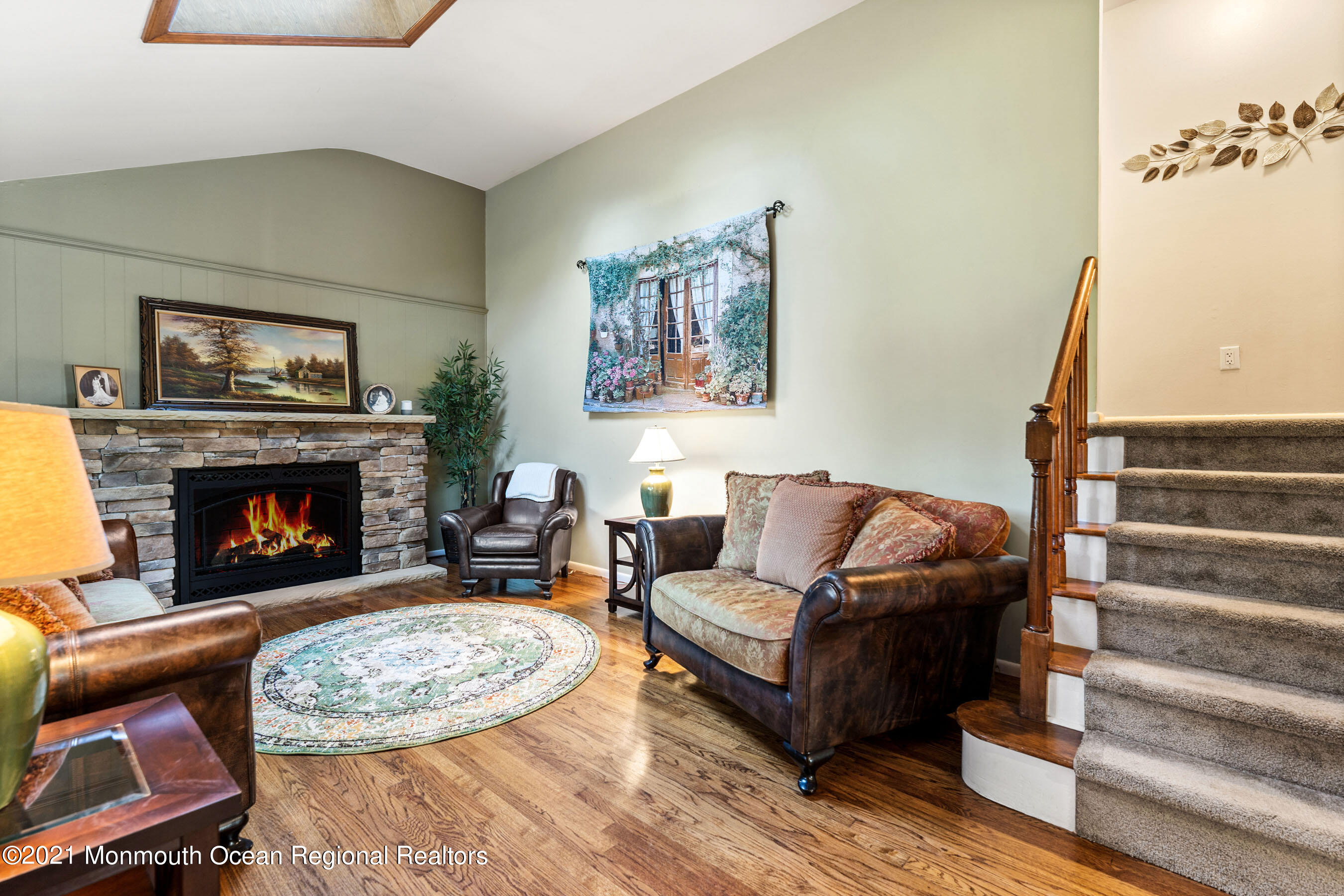 105 Bruce Road Red Bank, NJ 07701 - Photo 4 of 26 a living room with furniture and a fireplace