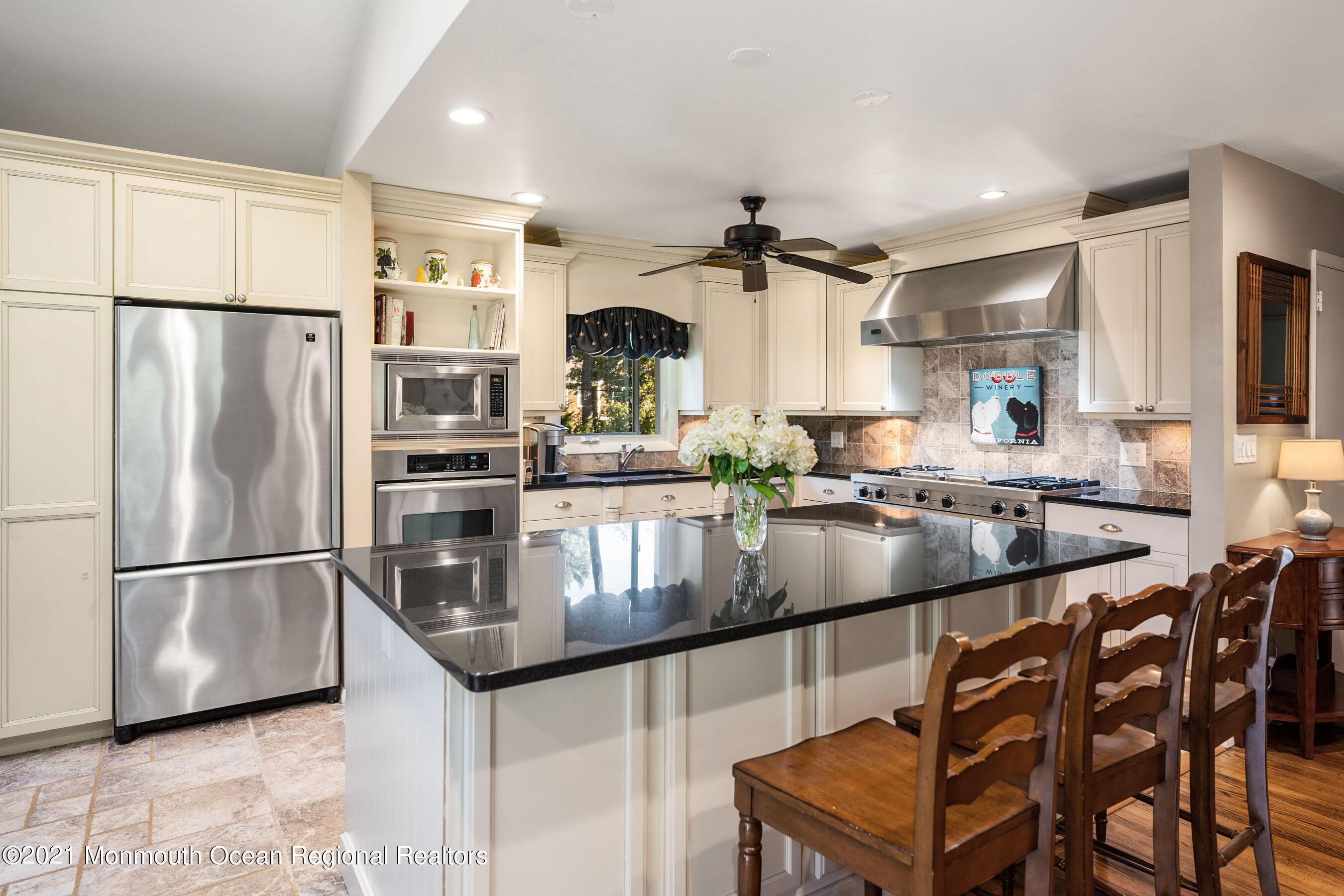 105 Bruce Road Red Bank, NJ 07701 - Photo 7 of 26 a kitchen with stainless steel appliances granite countertop a sink a stove and a refrigerator