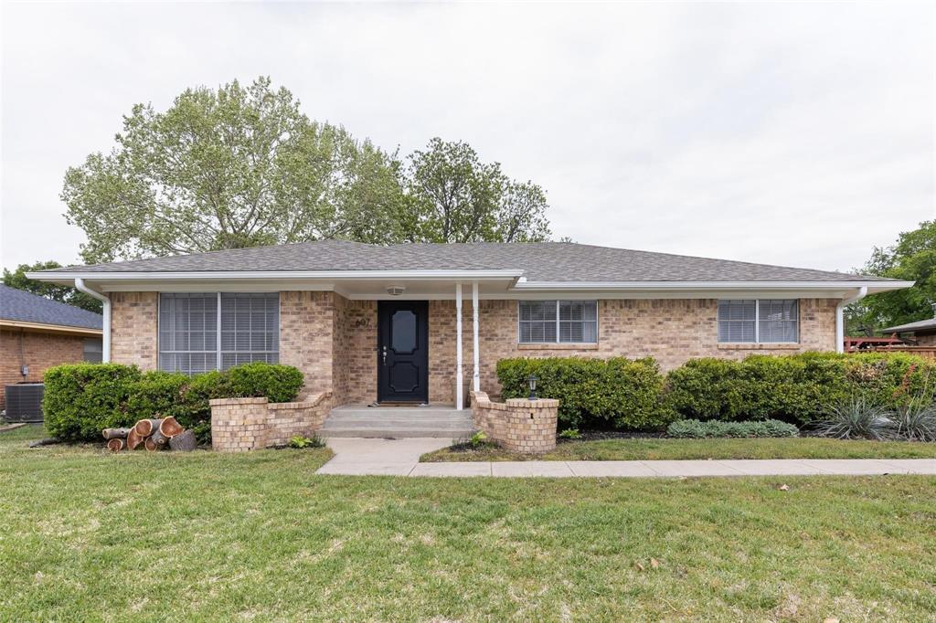 607 West Cedar Street Celina, TX 75009 - Photo 14 of 26 a front view of a house with a yard and potted plants