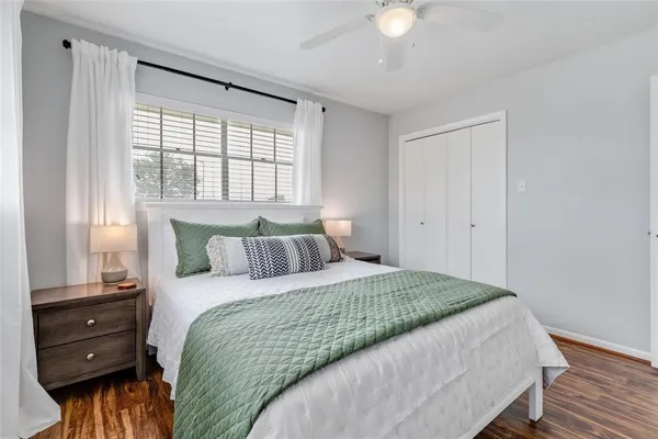 a bedroom with a bed and a window