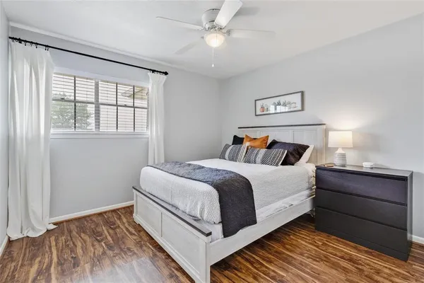 a bedroom with bed and window