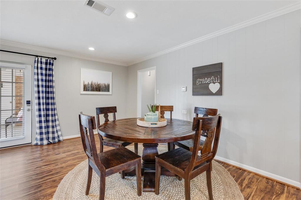 607 West Cedar Street Celina, TX 75009 - Photo 7 of 26 a view of a dining room with furniture and wooden floor