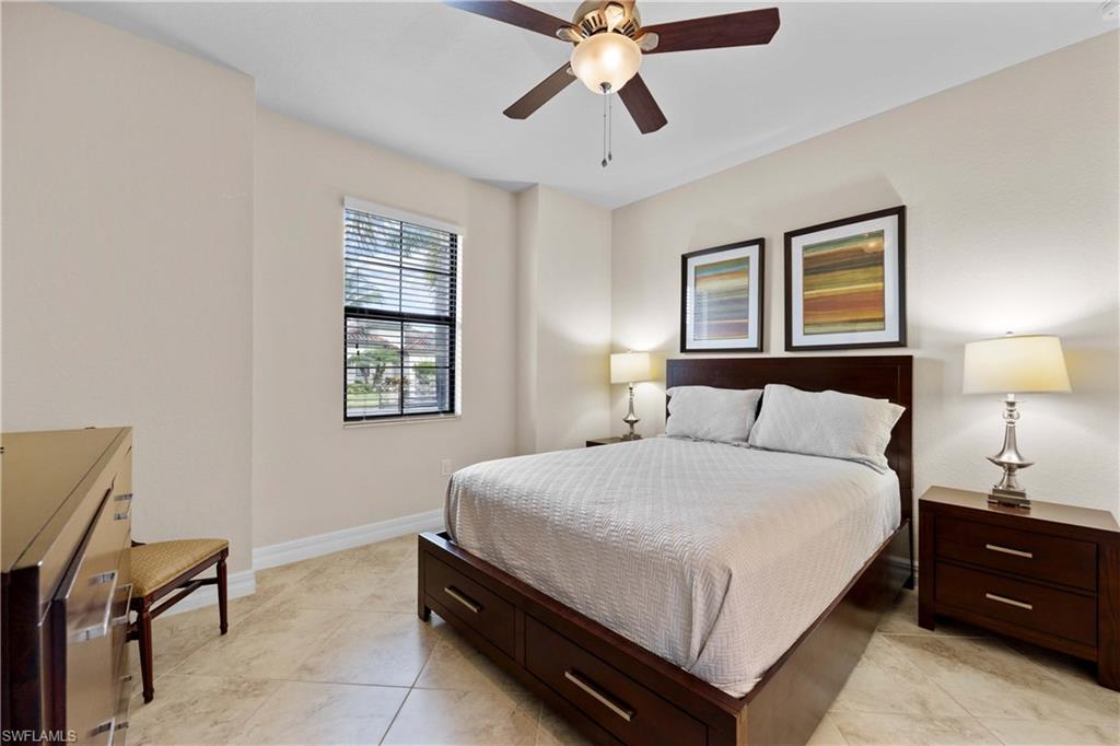 9254 Veneto Place Naples, FL 34113 - Photo 16 of 30 Tiled bedroom featuring ceiling fan