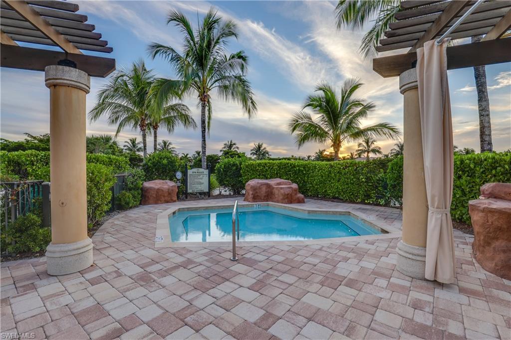 9254 Veneto Place Naples, FL 34113 - Photo 29 of 30 Pool at dusk featuring a pergola and a patio