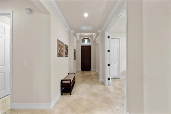 a view of a hallway with some storage and utility room