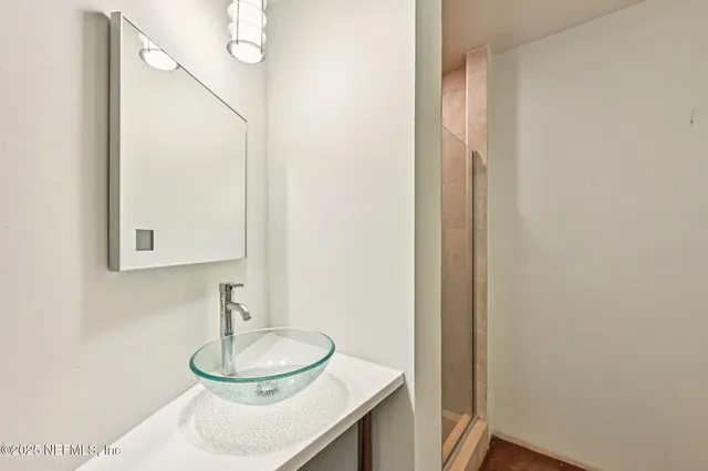 a bathroom with a sink and a mirror