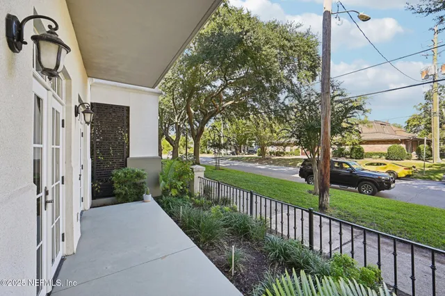 a view of a street with houses on both side of it