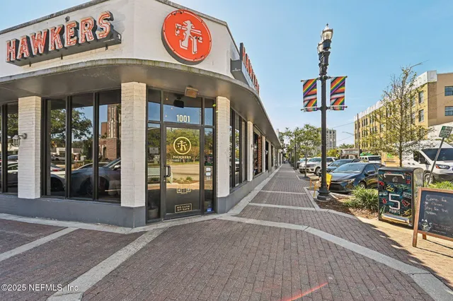 a view of a street with sitting area