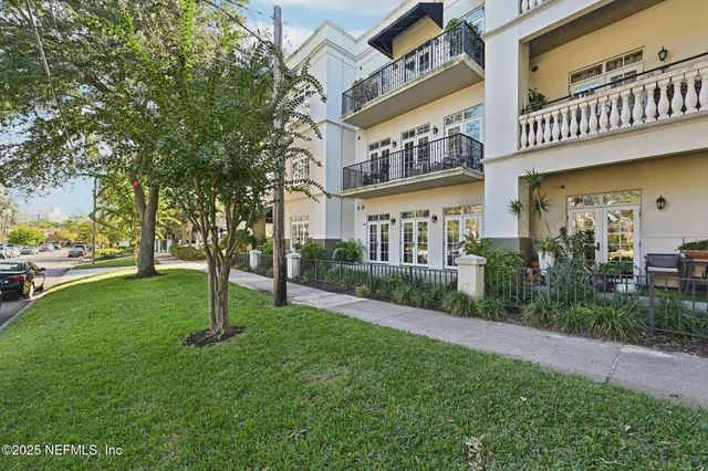 a view of a building with a yard