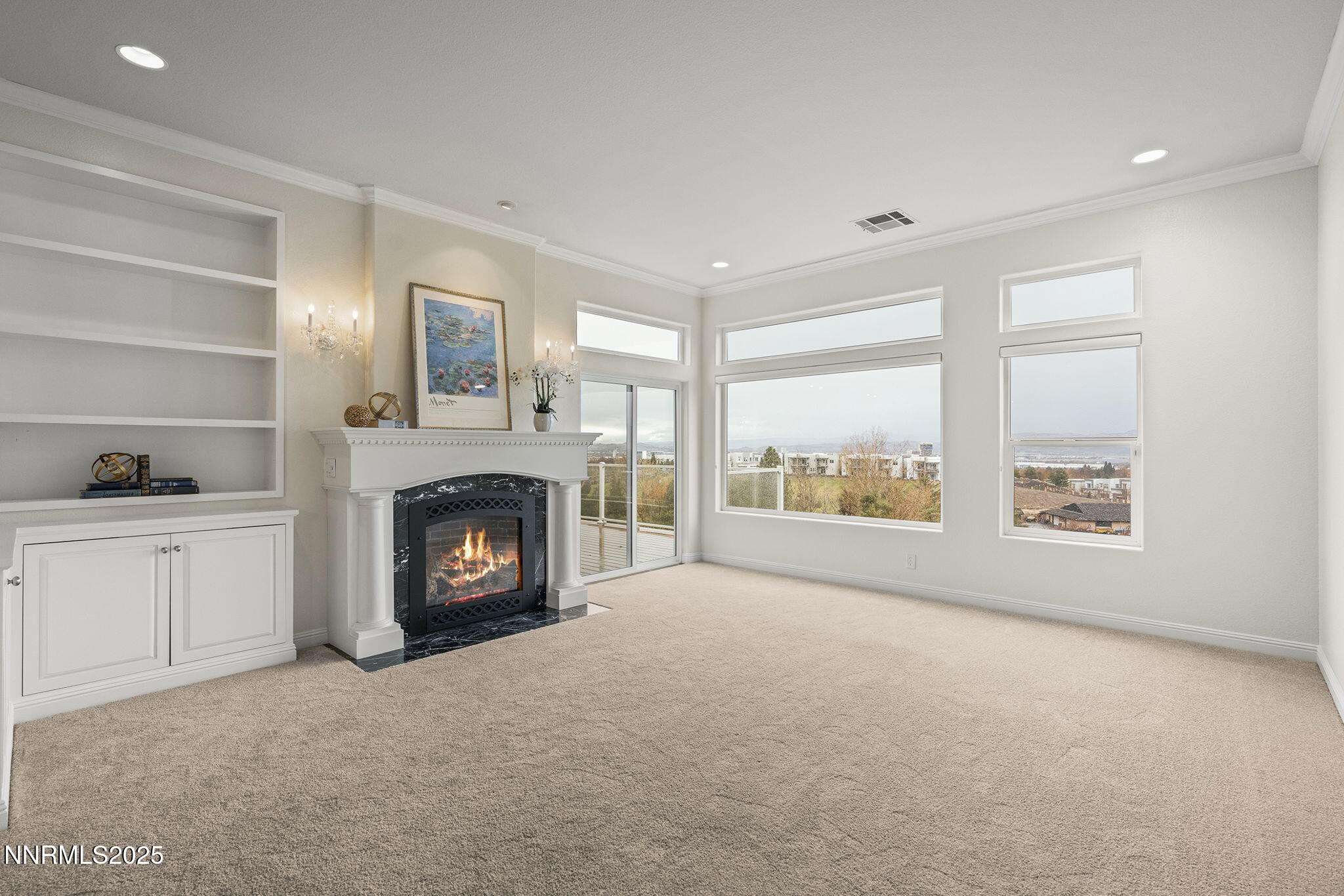 2636 Edgerock Road Reno, NV 89519 - Photo 11 of 54 a view of an empty room with a fireplace and a window