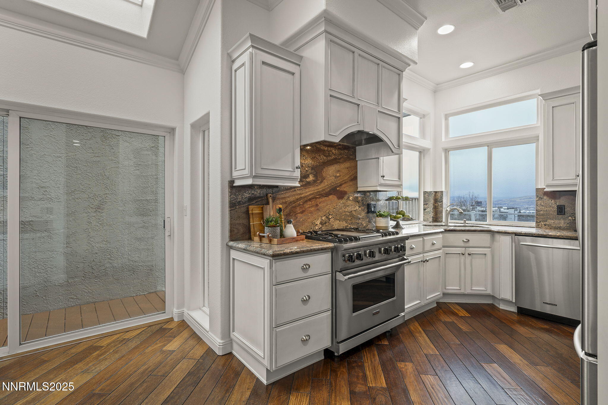 2636 Edgerock Road Reno, NV 89519 - Photo 14 of 54 a kitchen with a stove oven and sink