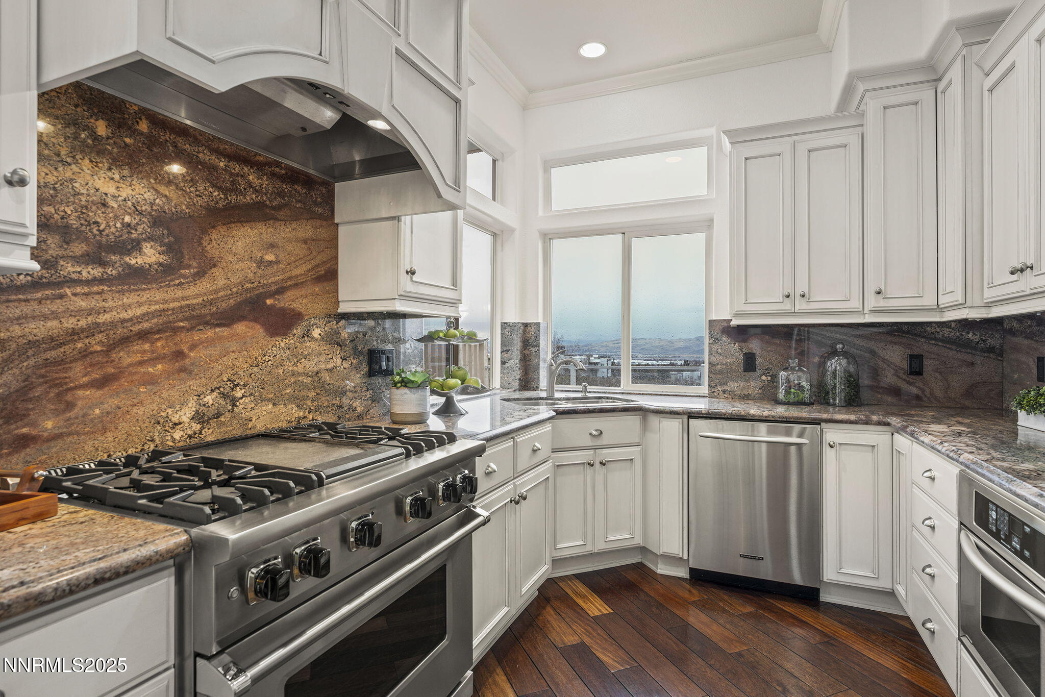 2636 Edgerock Road Reno, NV 89519 - Photo 15 of 54 a kitchen with a stove and white cabinets