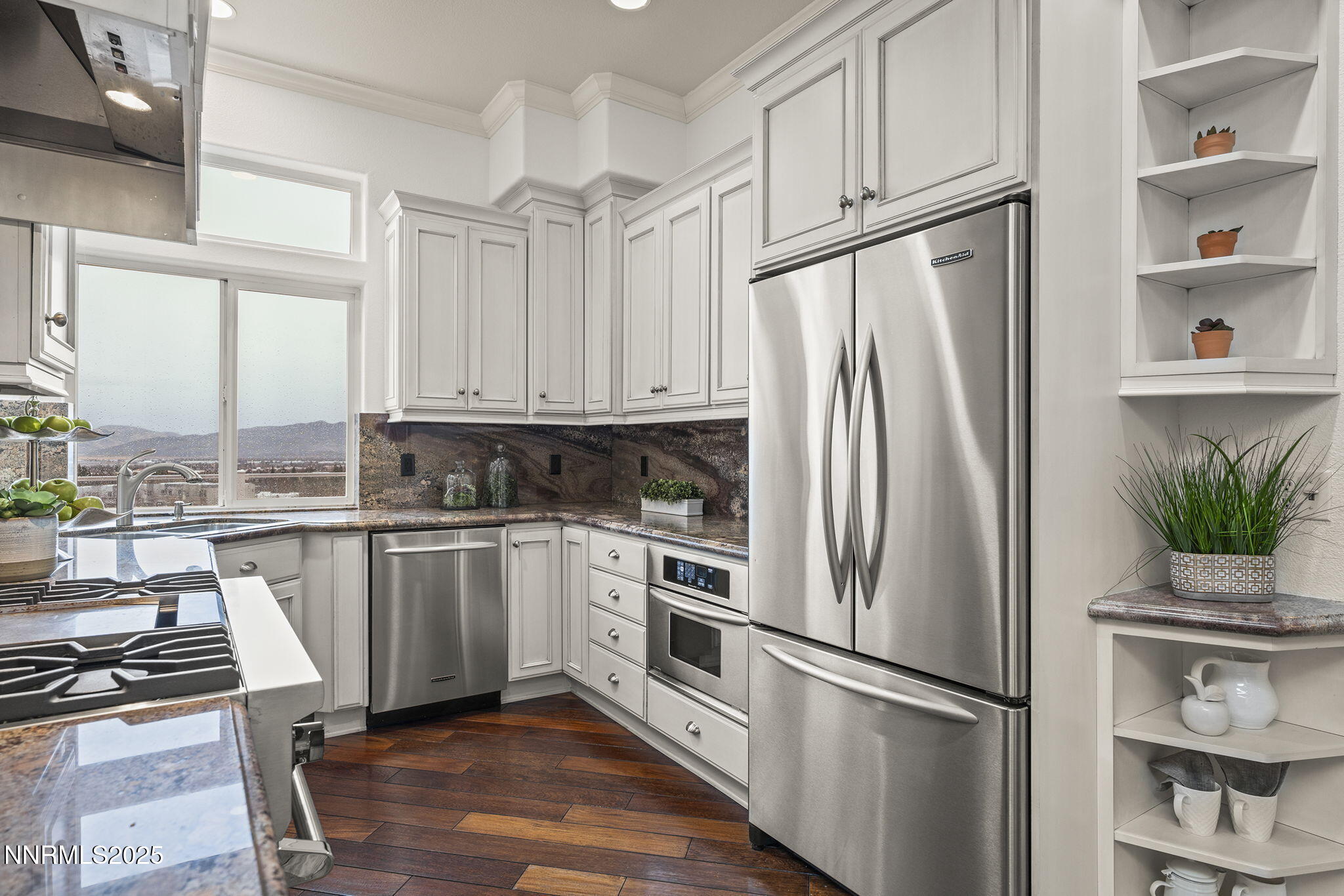 2636 Edgerock Road Reno, NV 89519 - Photo 16 of 54 a kitchen with stainless steel appliances a refrigerator stove and microwave