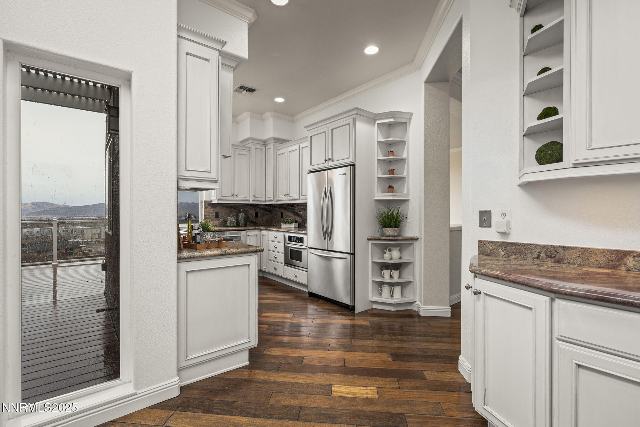 2636 Edgerock Road Reno, NV 89519 - Photo 17 of 54 a kitchen with white cabinets and stainless steel appliances
