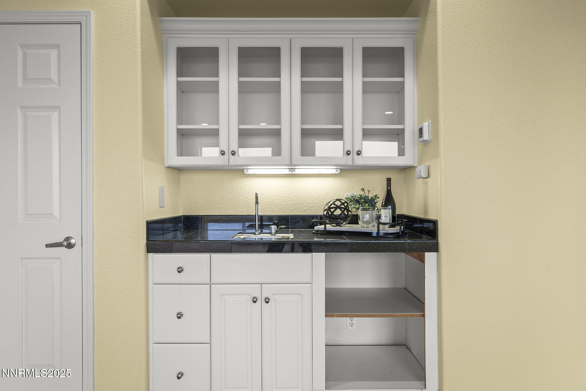 2636 Edgerock Road Reno, NV 89519 - Photo 27 of 54 a kitchen with granite countertop a sink and cabinets