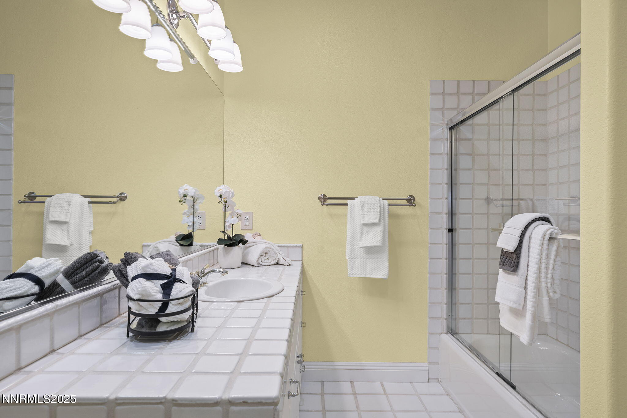 2636 Edgerock Road Reno, NV 89519 - Photo 29 of 54 a bathroom with a sink mirror and shower