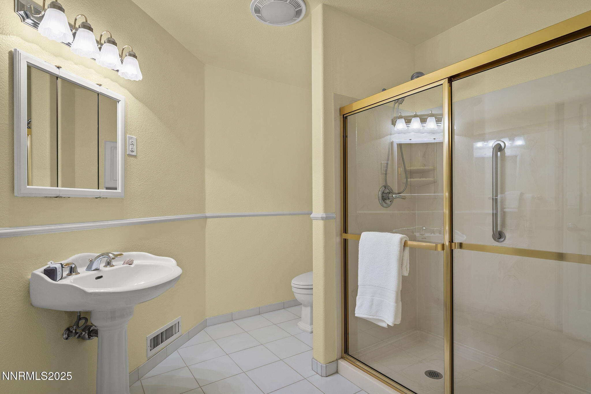 2636 Edgerock Road Reno, NV 89519 - Photo 32 of 54 a bathroom with a sink a toilet and shower