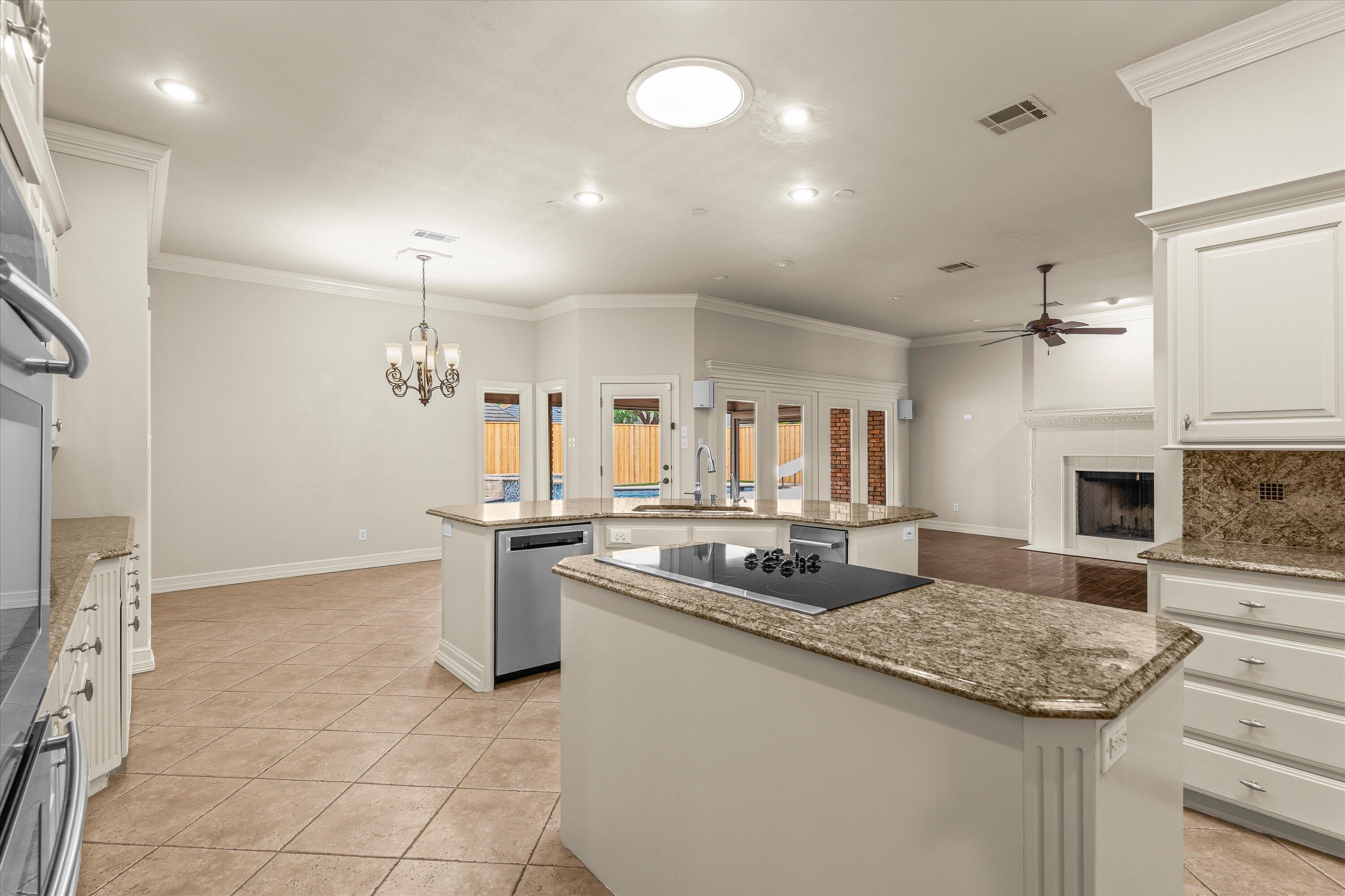 5110 96th Street Lubbock, TX 79424 - Photo 13 of 50 a kitchen with a stove and a sink