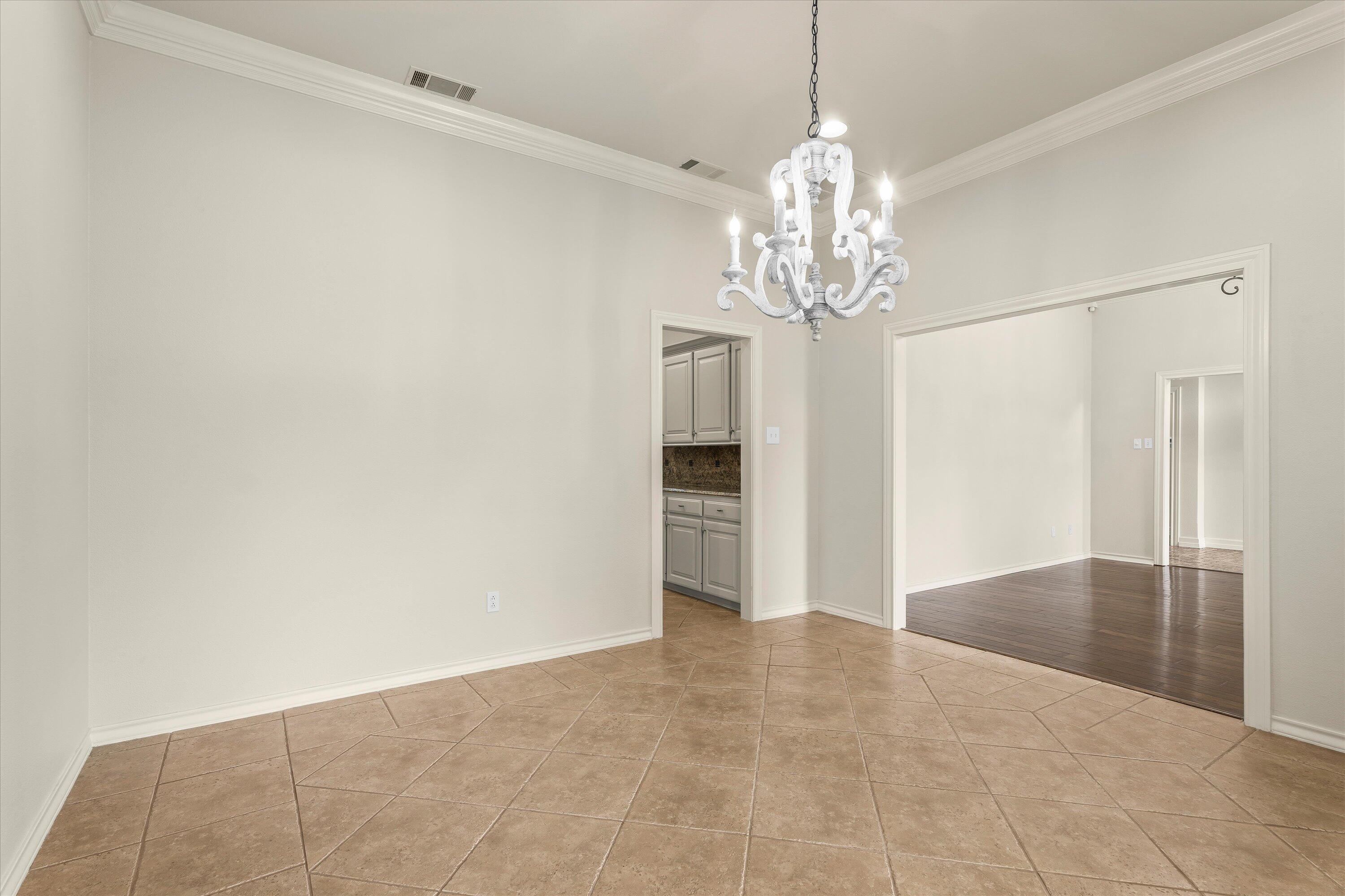 5110 96th Street Lubbock, TX 79424 - Photo 19 of 50 a view of a chandelier in a room