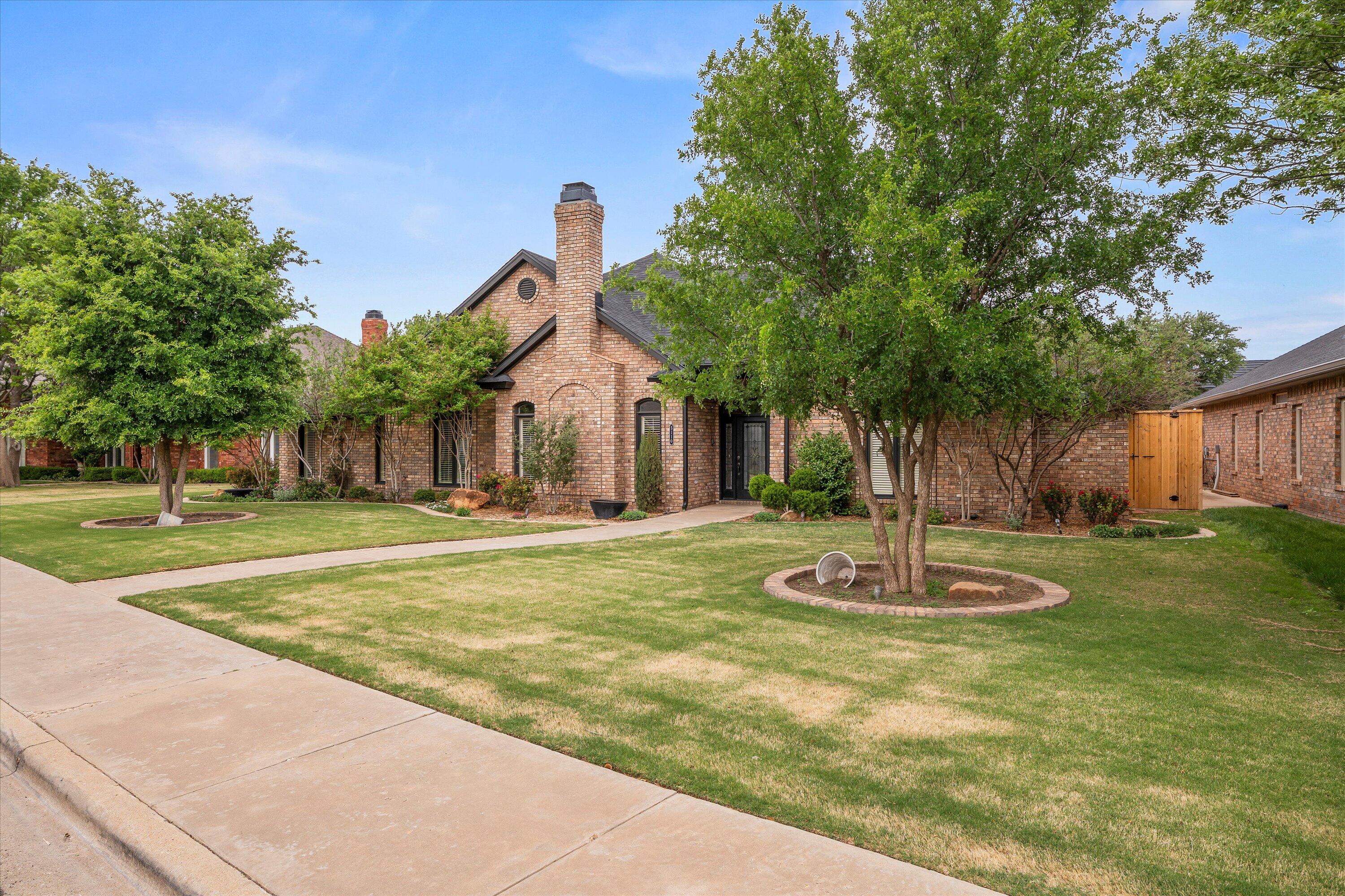 5110 96th Street Lubbock, TX 79424 - Photo 2 of 50 a building with trees in the background