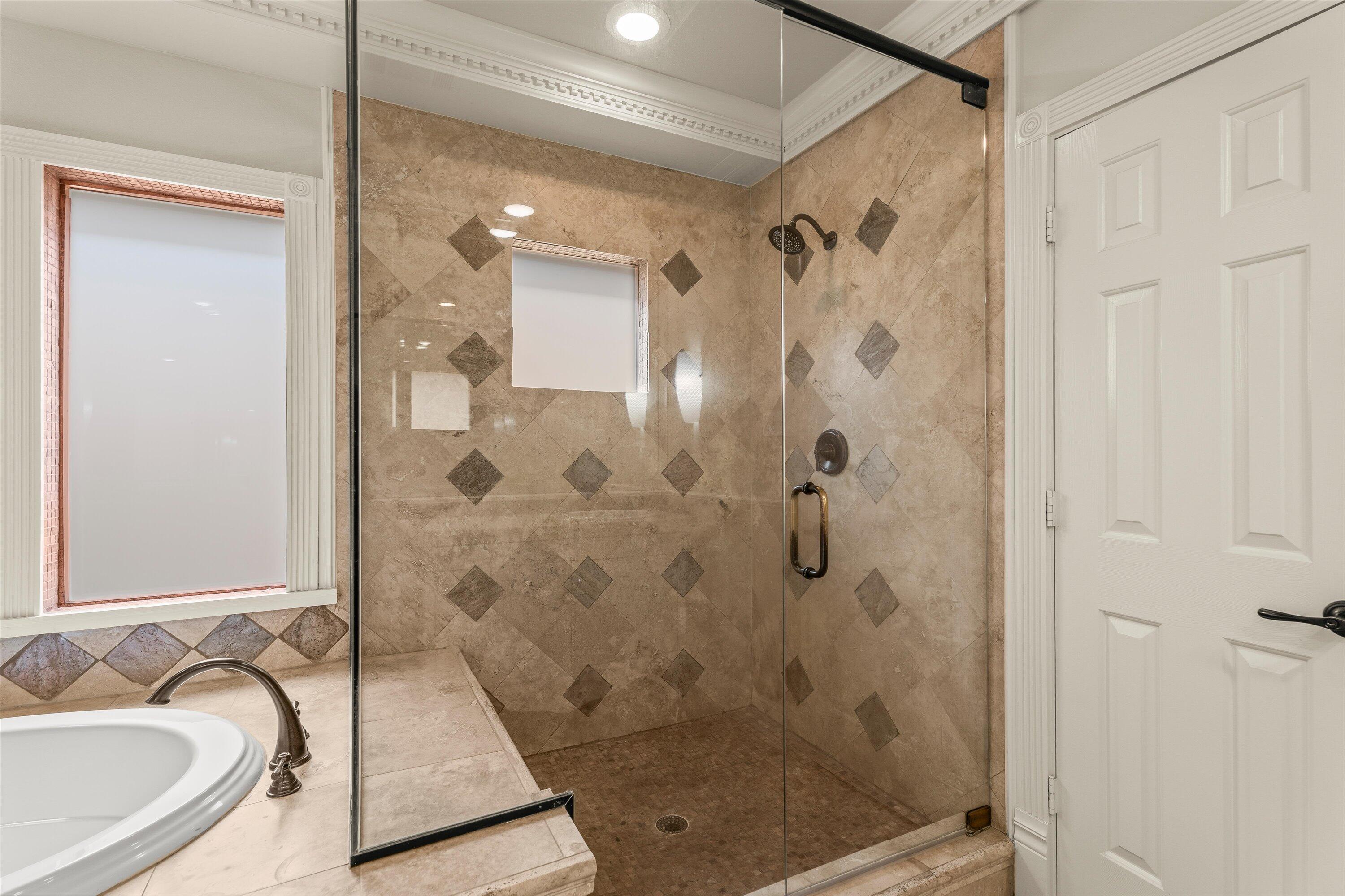 5110 96th Street Lubbock, TX 79424 - Photo 25 of 50 a bathroom with a bathtub and a shower