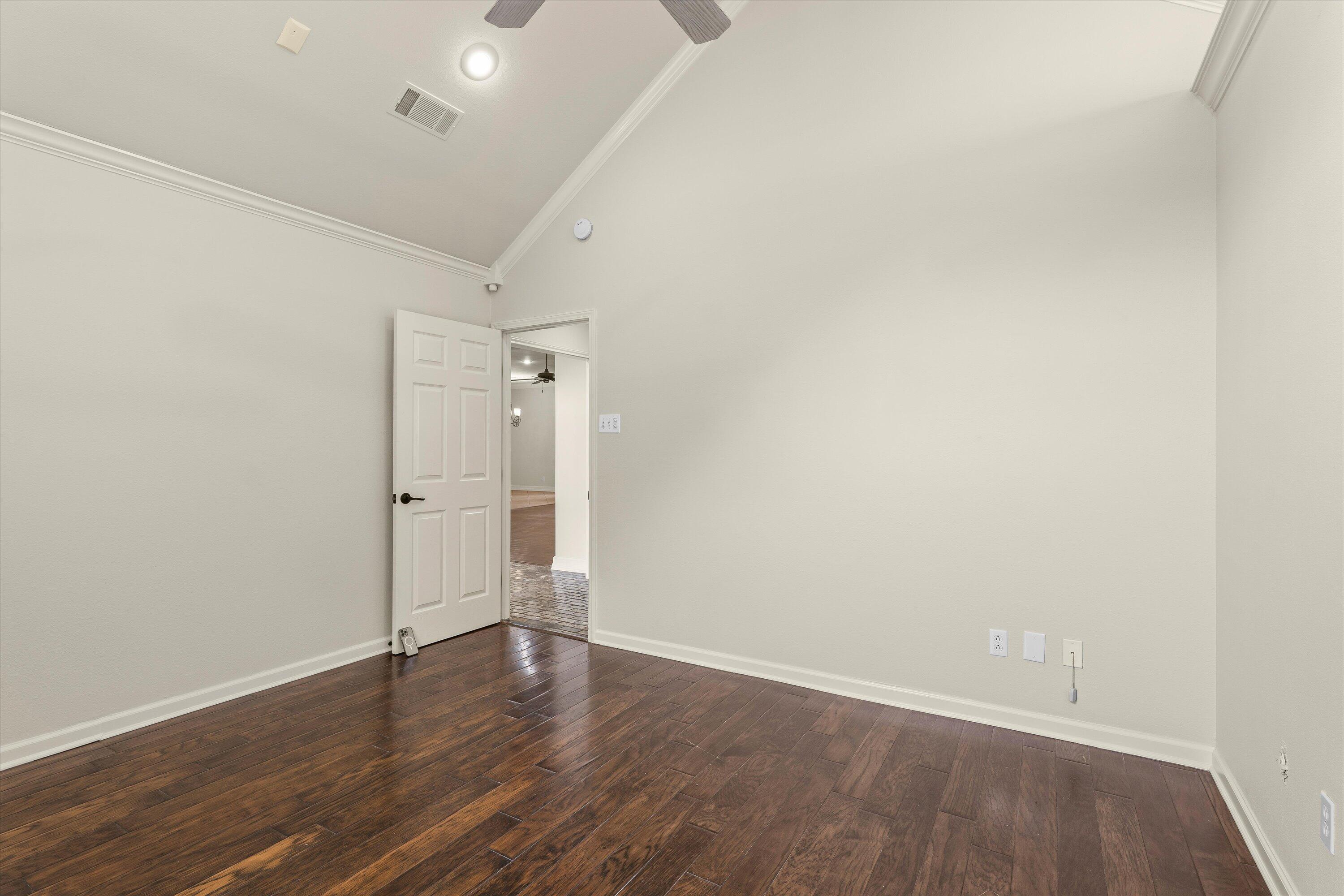 5110 96th Street Lubbock, TX 79424 - Photo 29 of 50 a view of an empty room with wooden floor