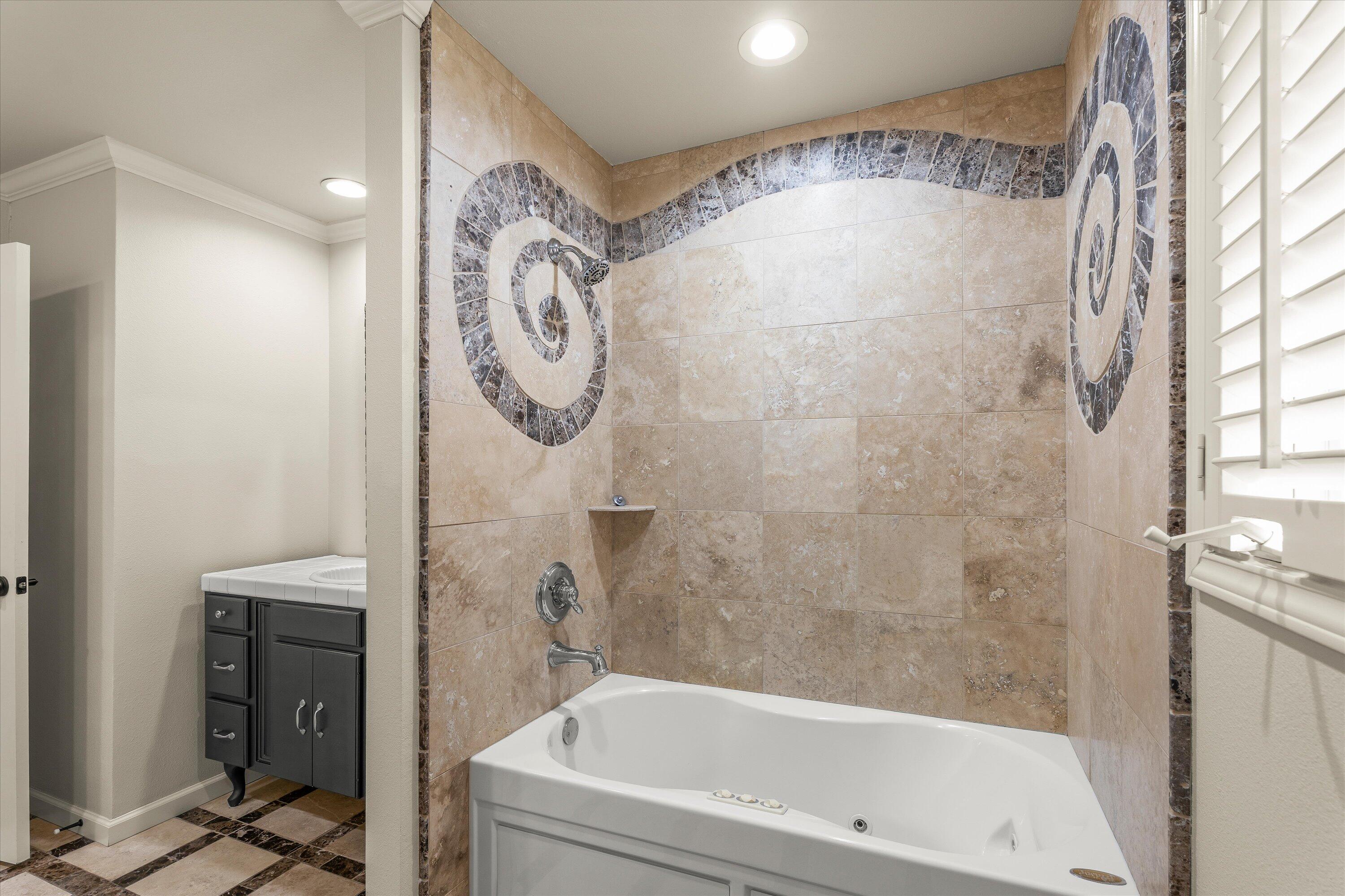 5110 96th Street Lubbock, TX 79424 - Photo 35 of 50 a bathroom with a bathtub and a shower