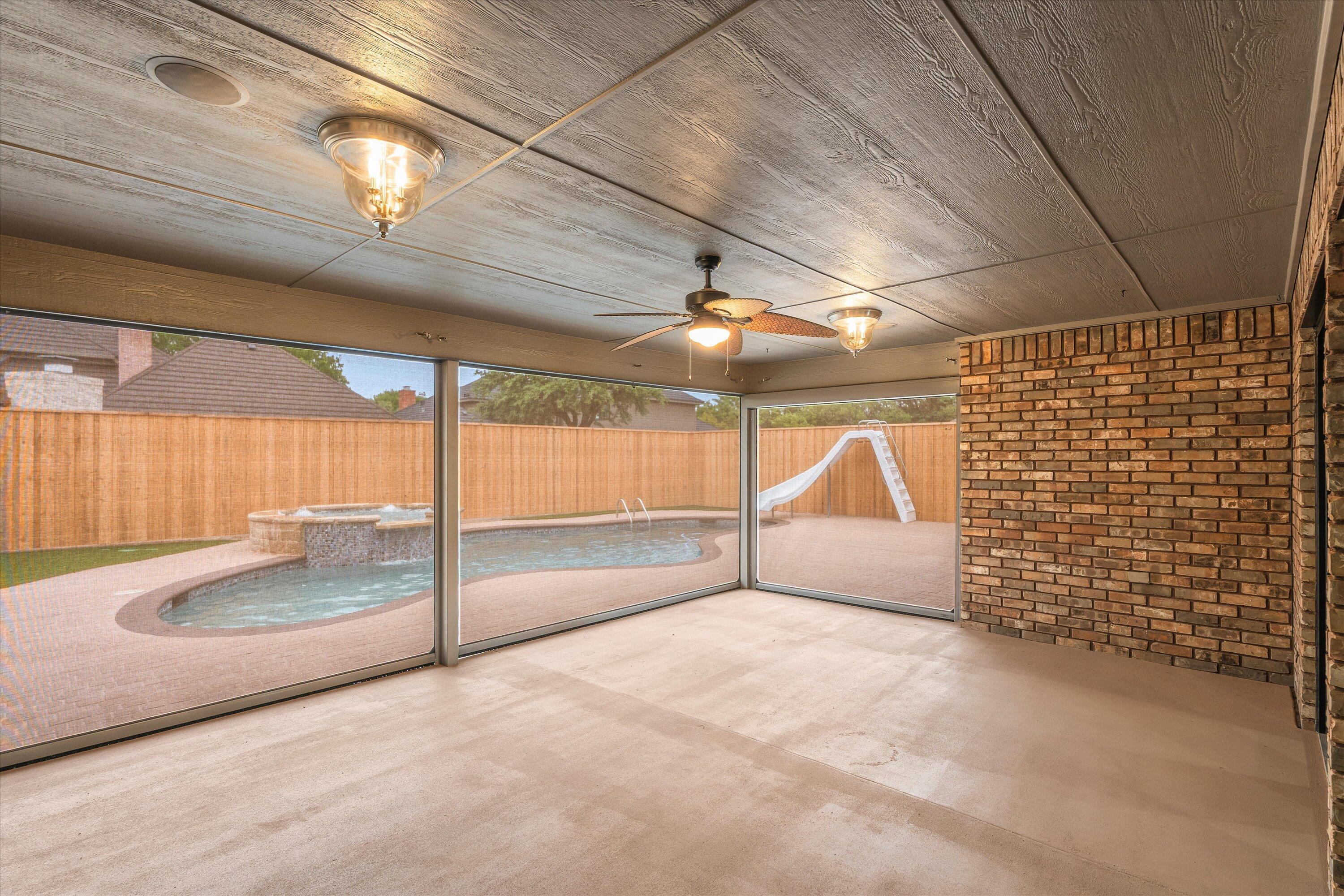 5110 96th Street Lubbock, TX 79424 - Photo 46 of 50 a view of an empty room with a fireplace