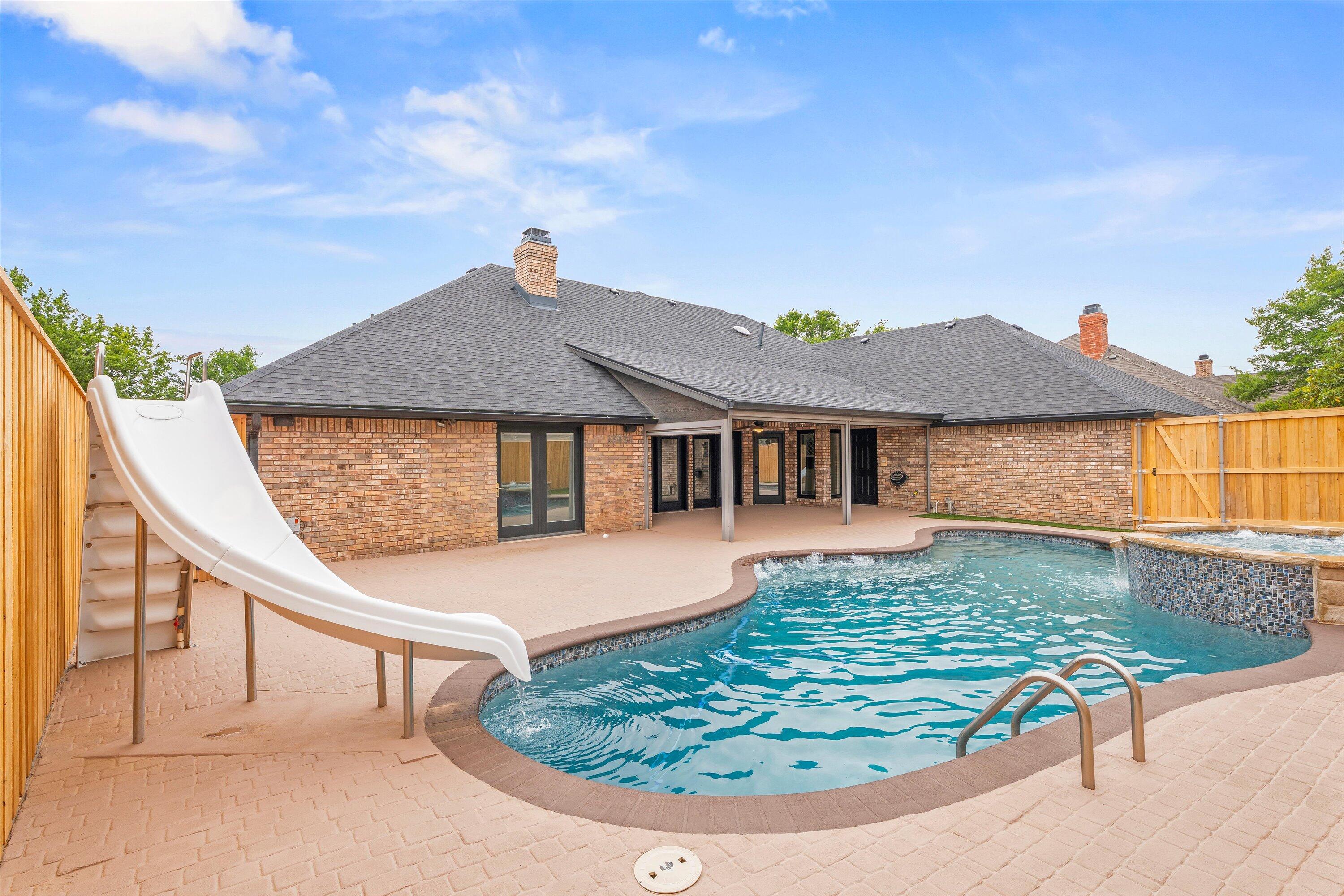 5110 96th Street Lubbock, TX 79424 - Photo 49 of 50 a front view of a house with garden