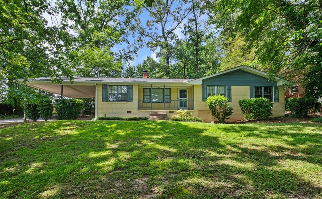 a front view of house with yard and green space