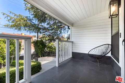 a view of a balcony with furniture