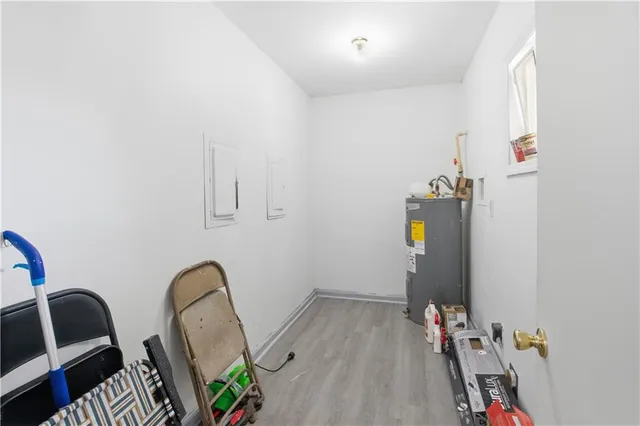 a view of room with guitars and wooden floor